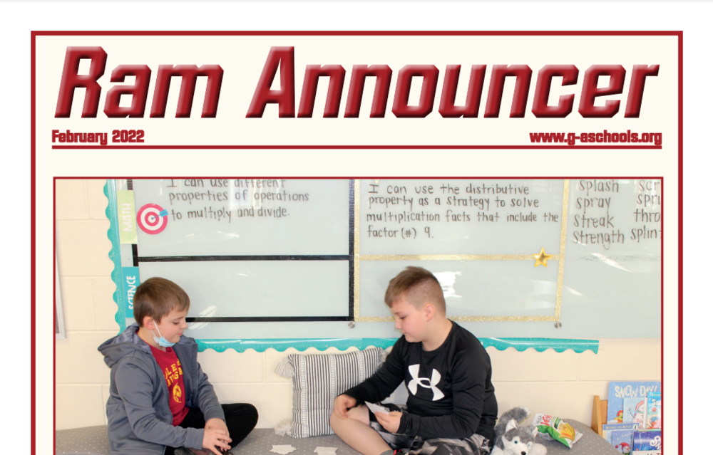 Text: Ram Announcer February 2022. A photo of two students sitting across from one another with flashcards